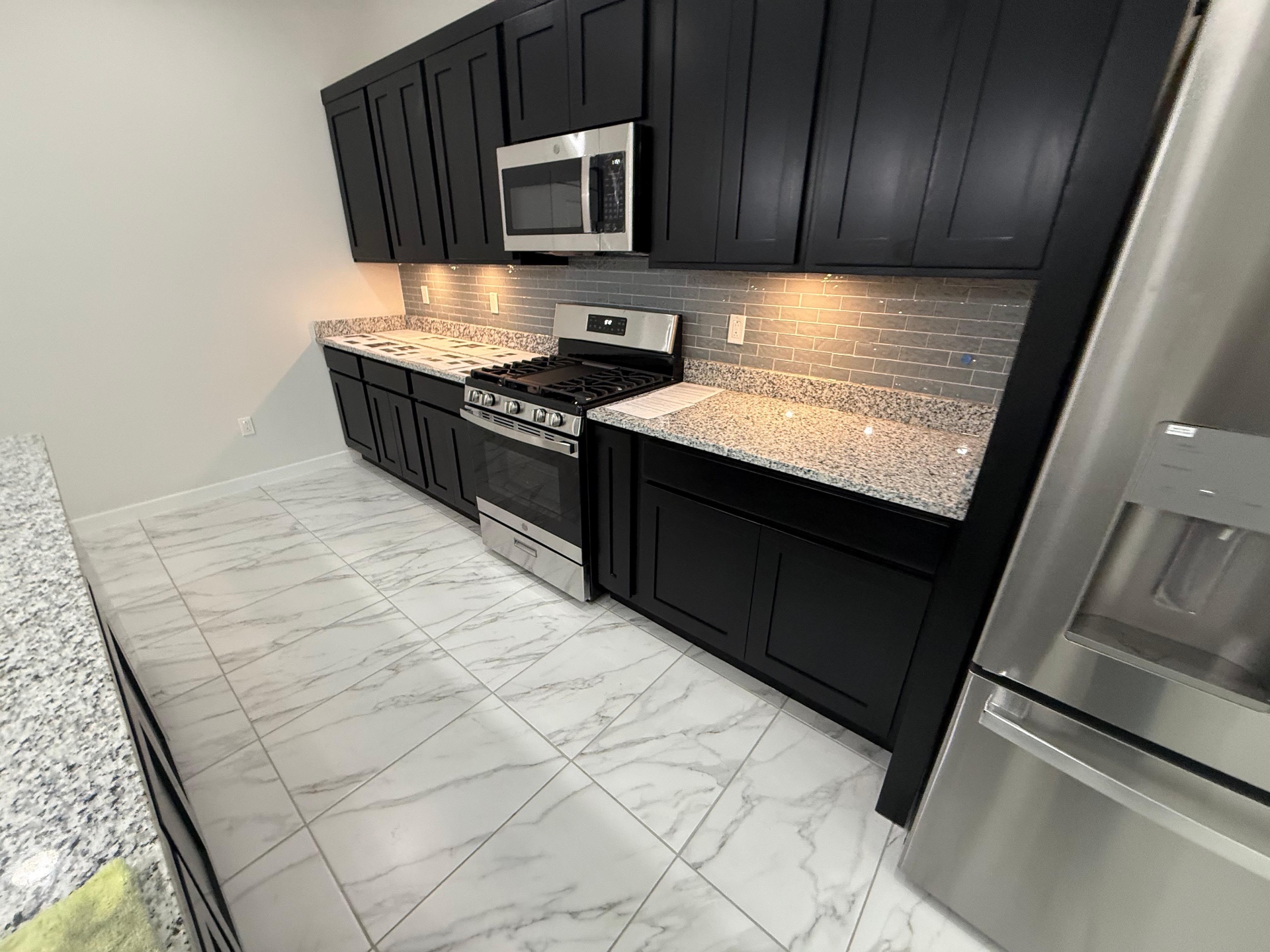 Dark wood kitchen cabinets in a residential remodel