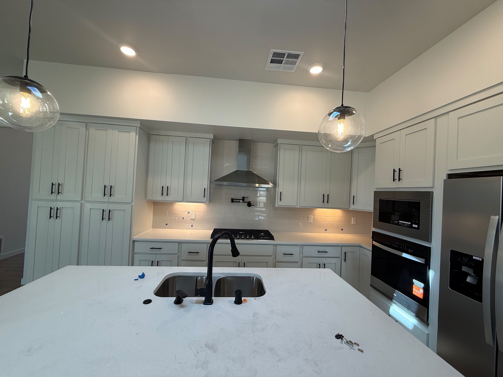 White kitchen under a vaulted ceiling