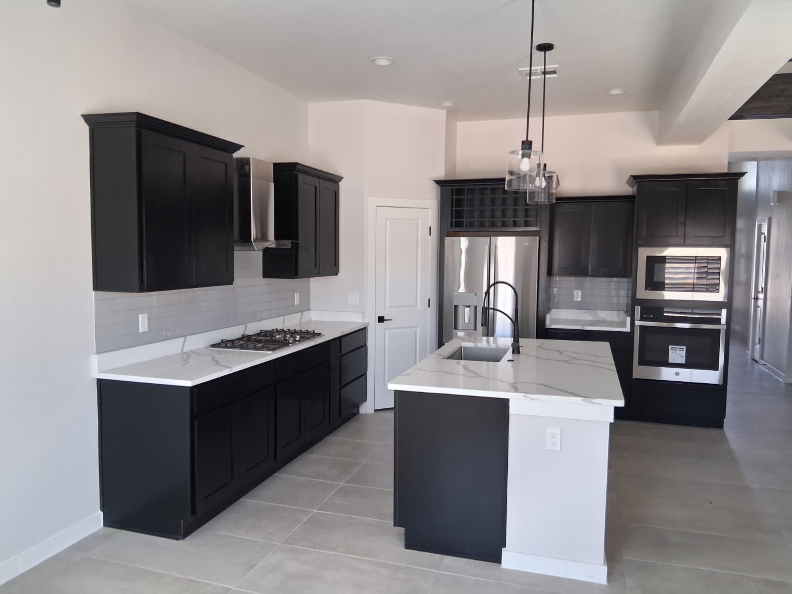 Black cabinets with quartz countertops