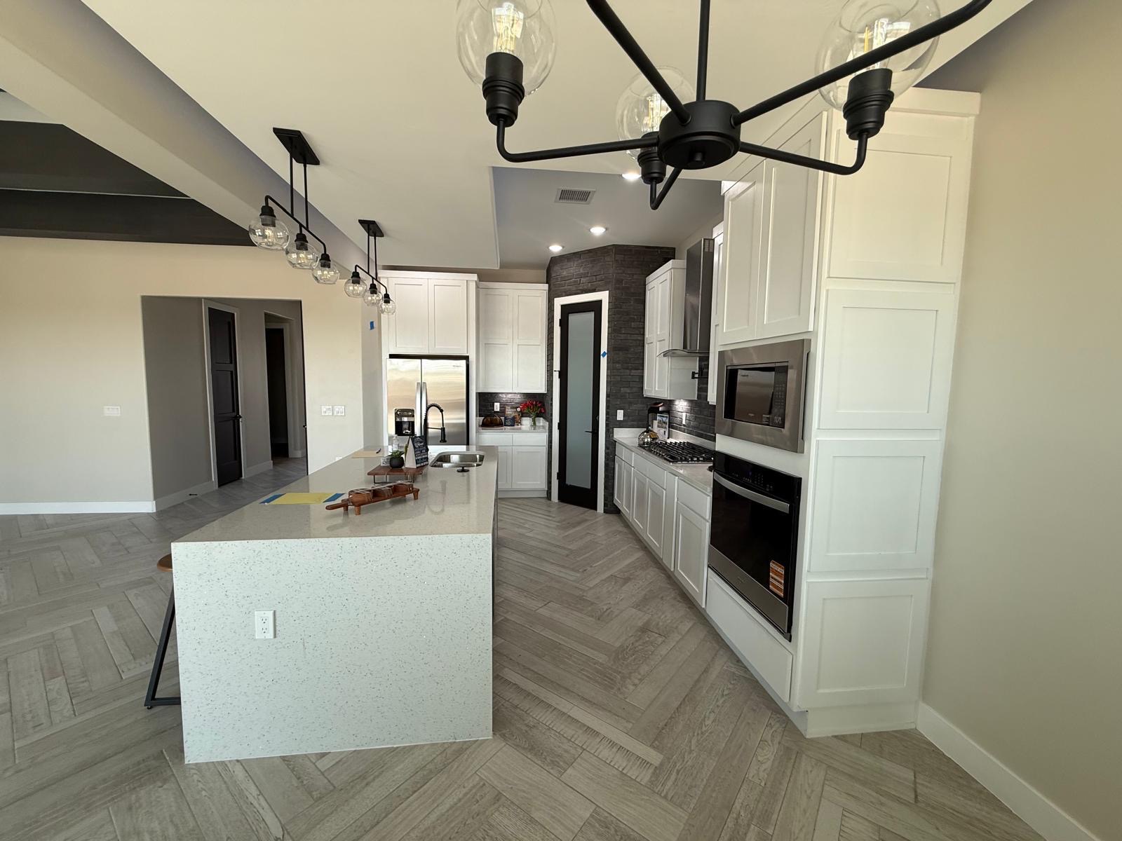 Finished kitchen with quartz countertops by JLT Cabinets