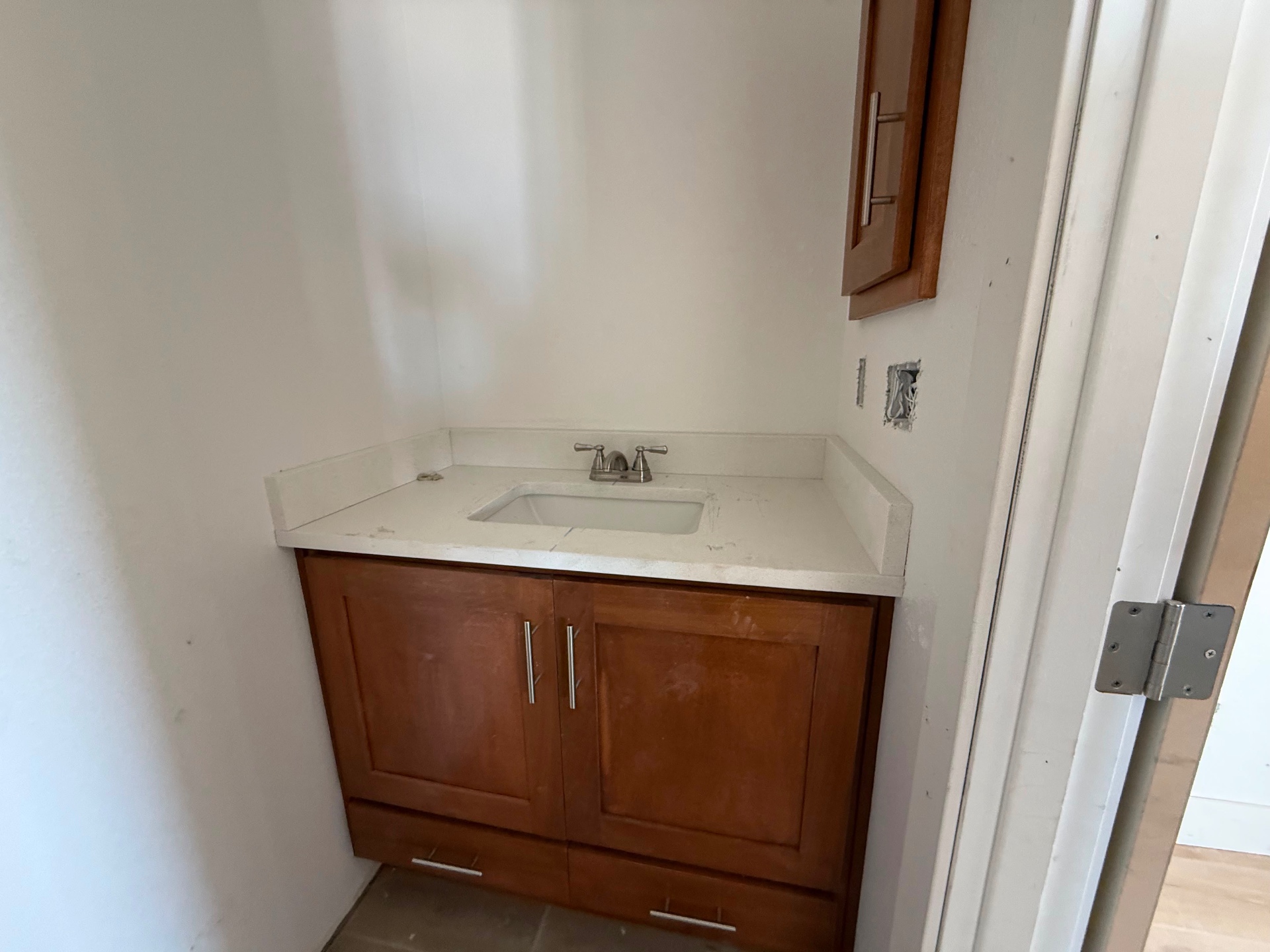 Cherry wood vanity cabinets in a bathroom remodel