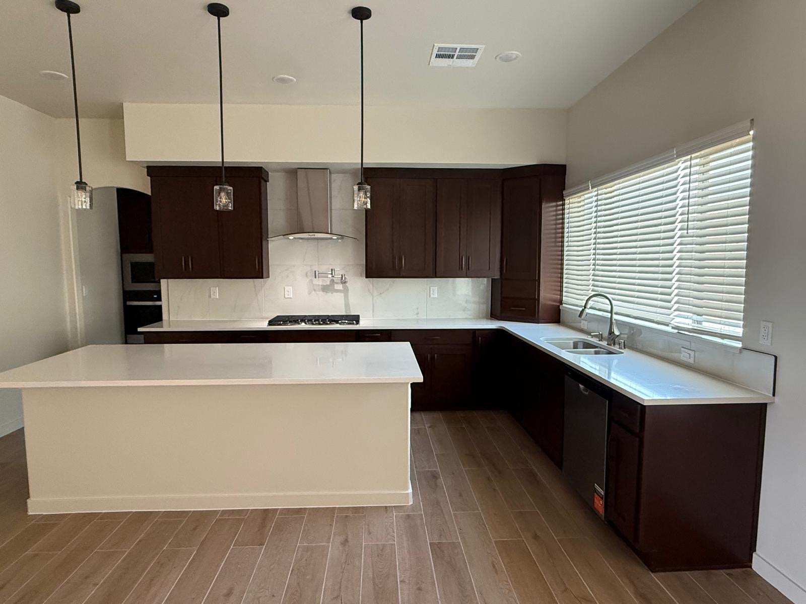 Espresso wood kitchen cabinets after cabinet installation