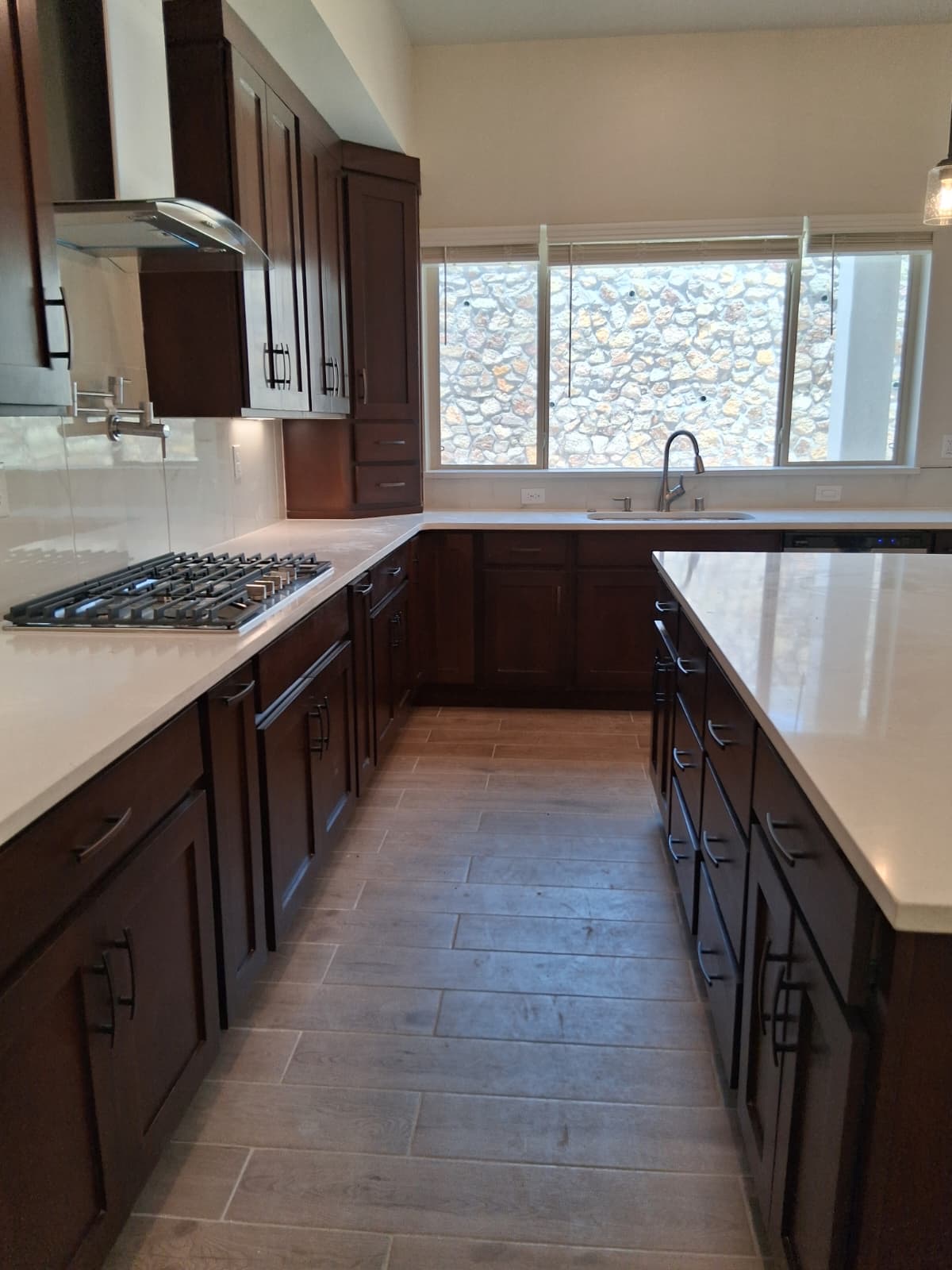 Wood kitchen island with countertop in a remodeled kitchen