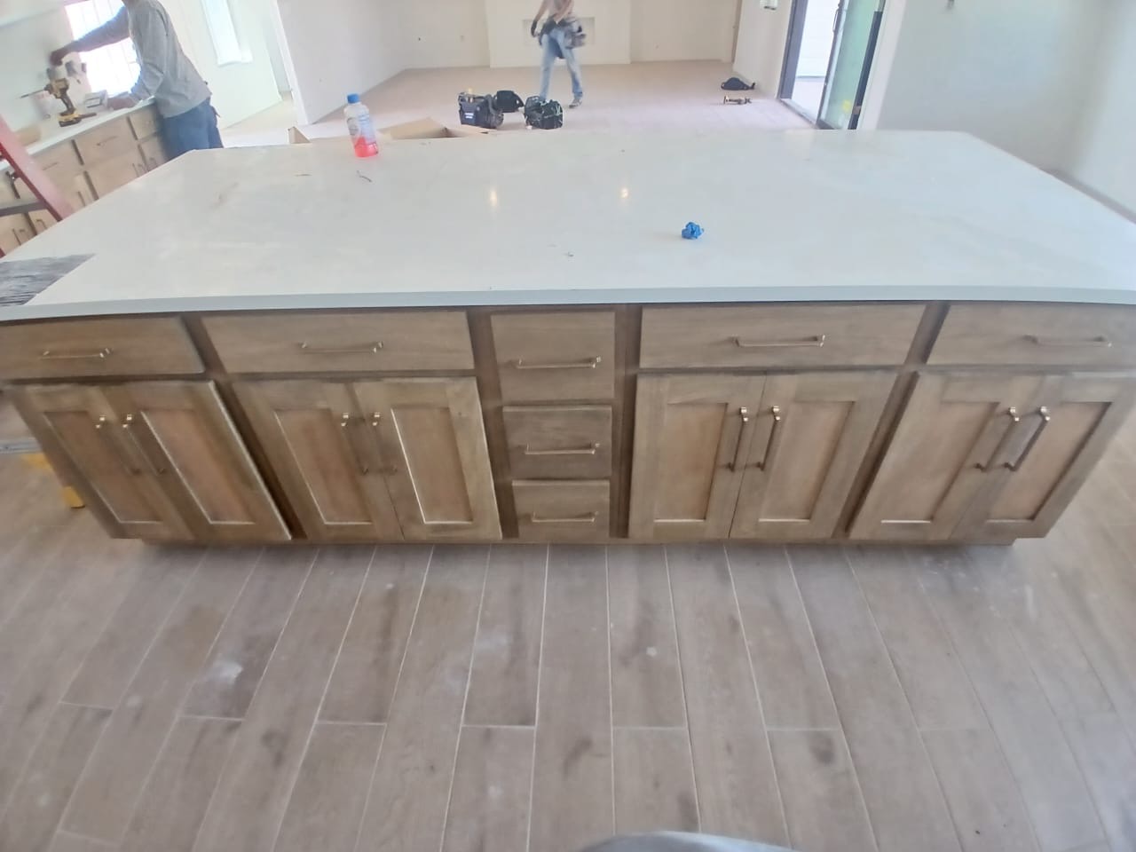 Maple wood kitchen cabinets with stone countertops